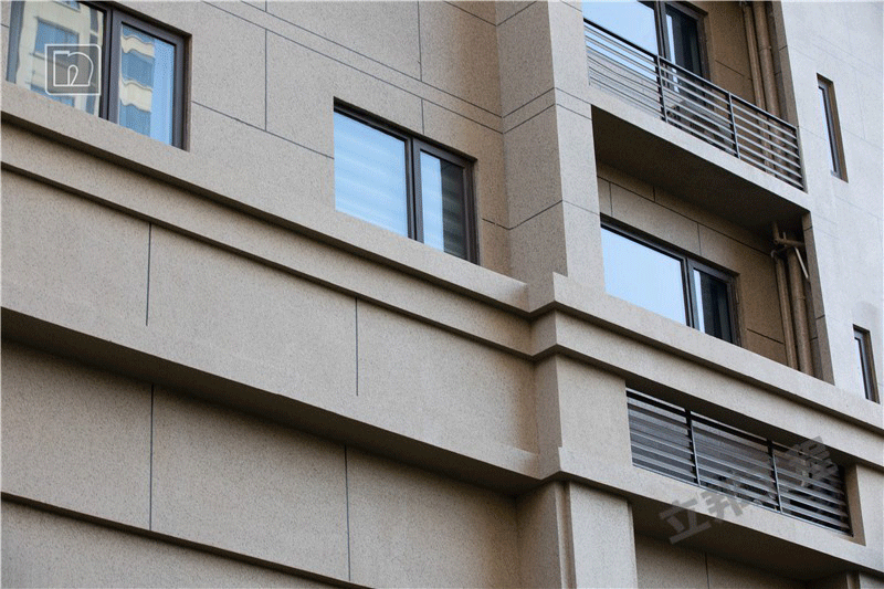 近處觀測立邦水包砂涂裝案例長沙萬科金域藍灣二期墻面效果圖.png